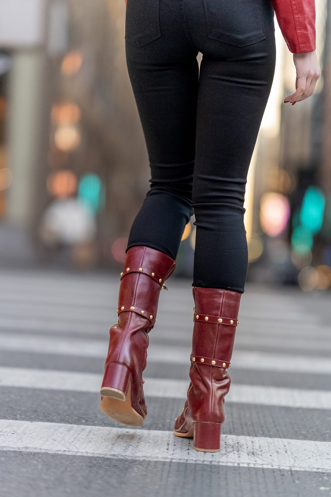 Oxblood Vivienne boots crossing the street